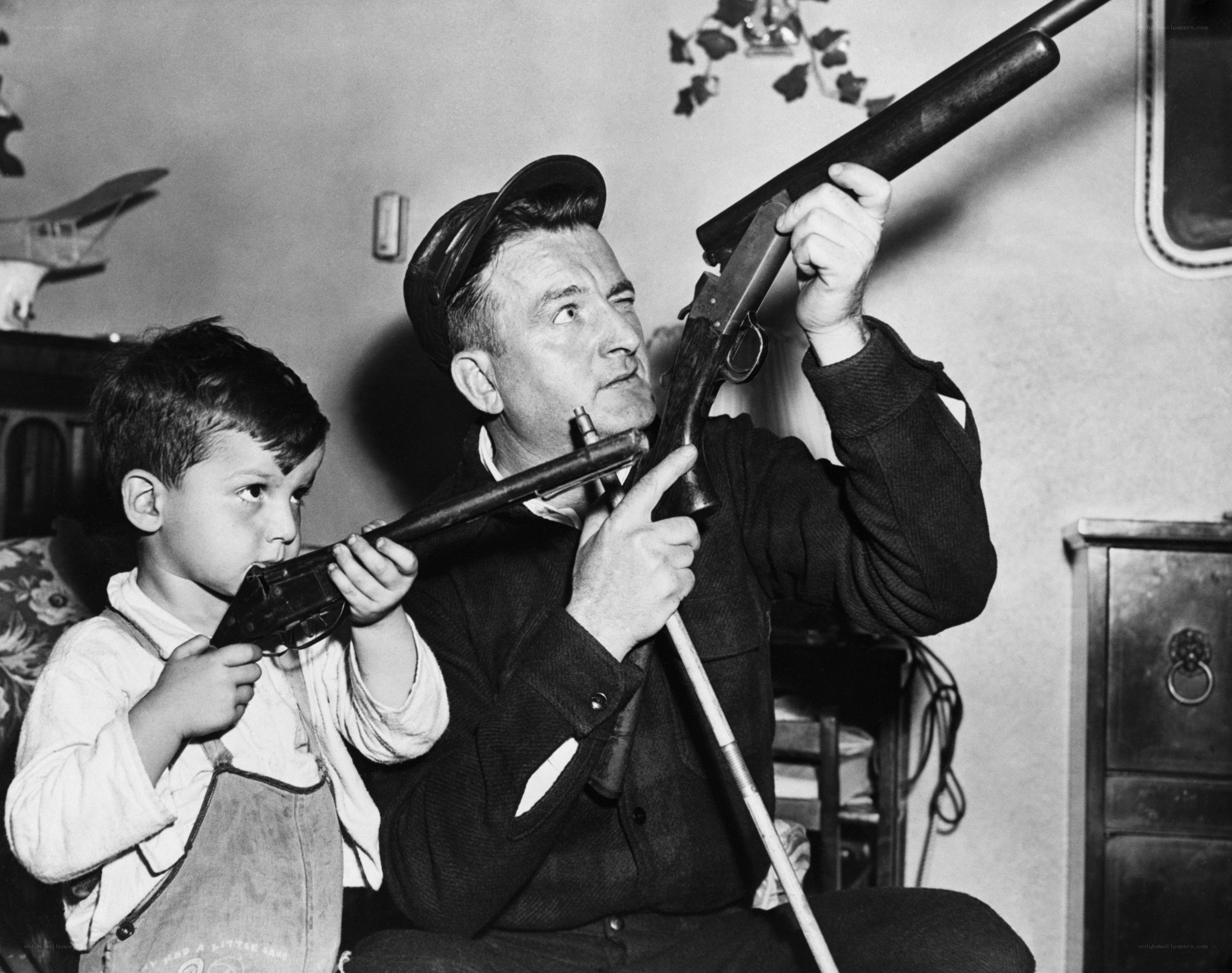 Man and boy with toy guns