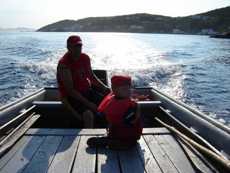 Man and Child in Boat — Red