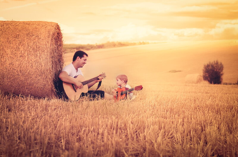 Man and Child in Field — Gold