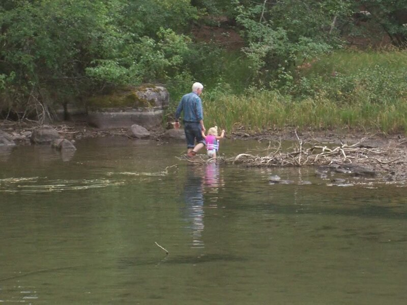 Man and Child in River
