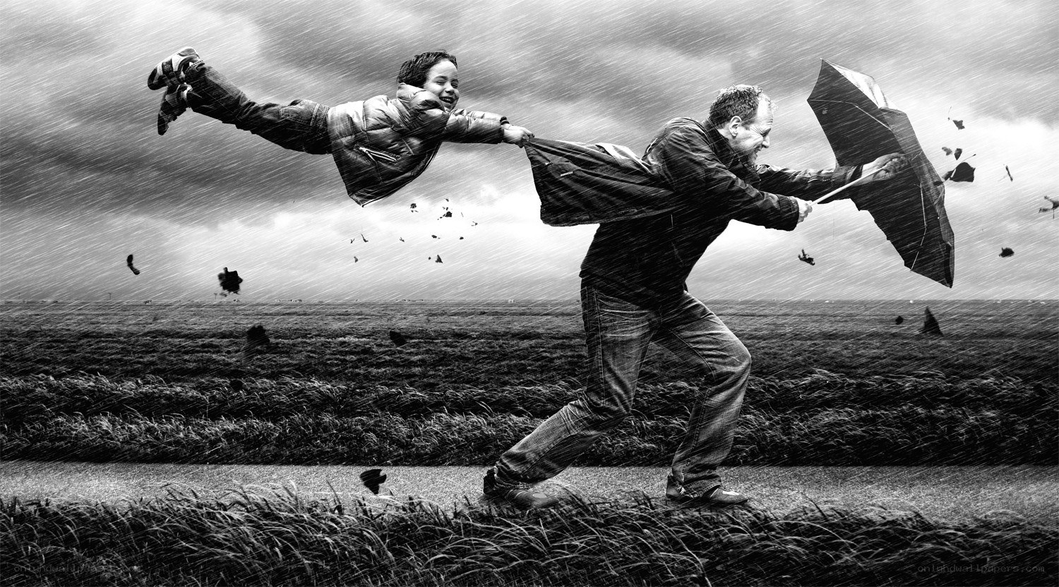 Man and child in storm