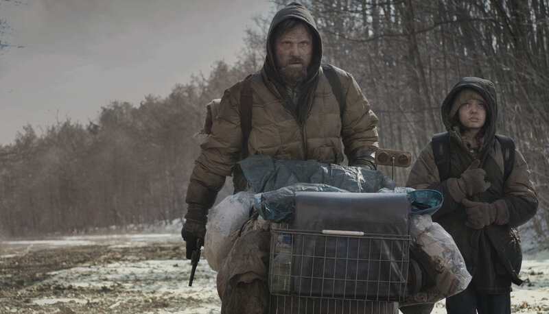 Man and child in winter survival