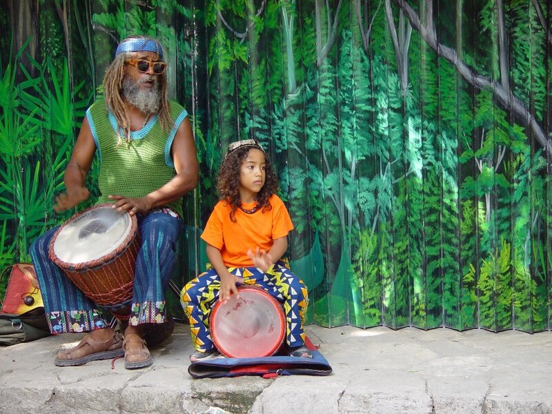 Man and Child Playing Drums