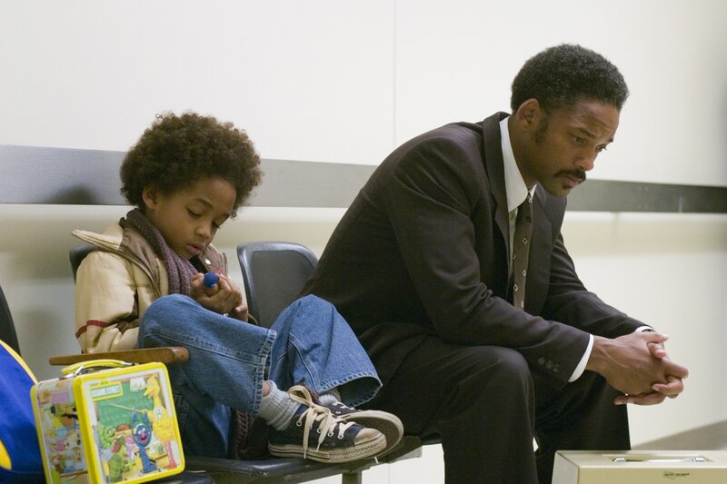 Man and child waiting in a room