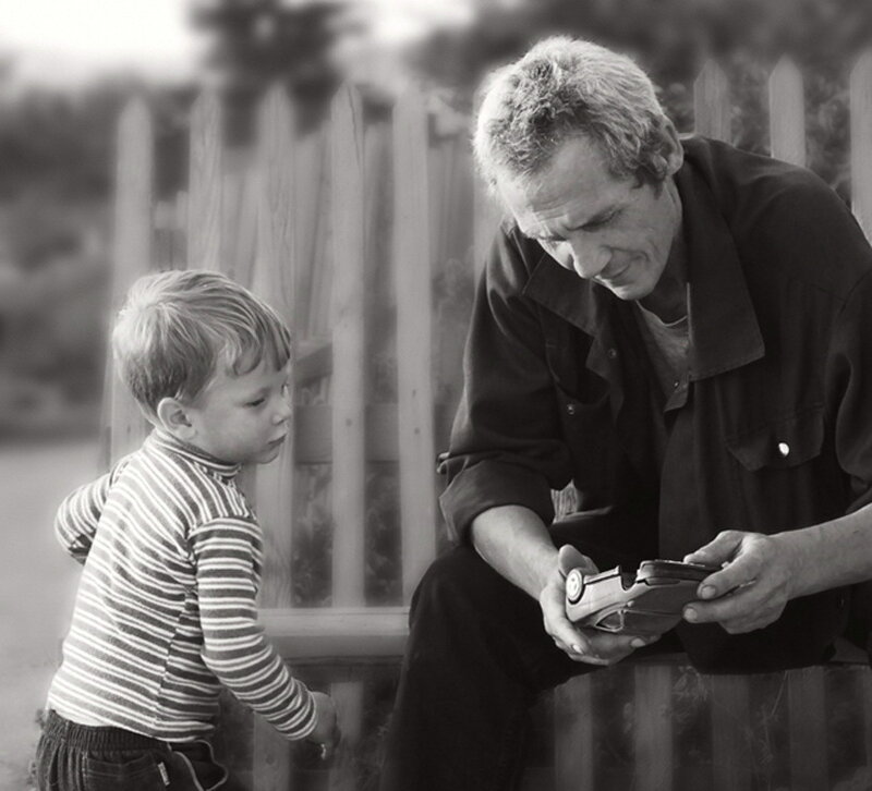 Man and Child with Toy Car