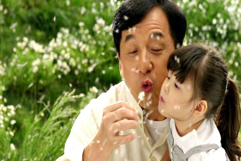 Man and Girl Blowing Dandelion