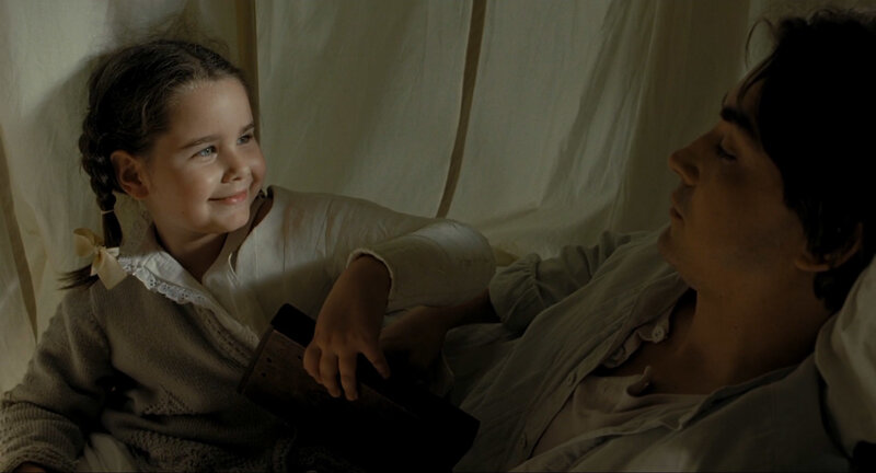 man and girl in tent