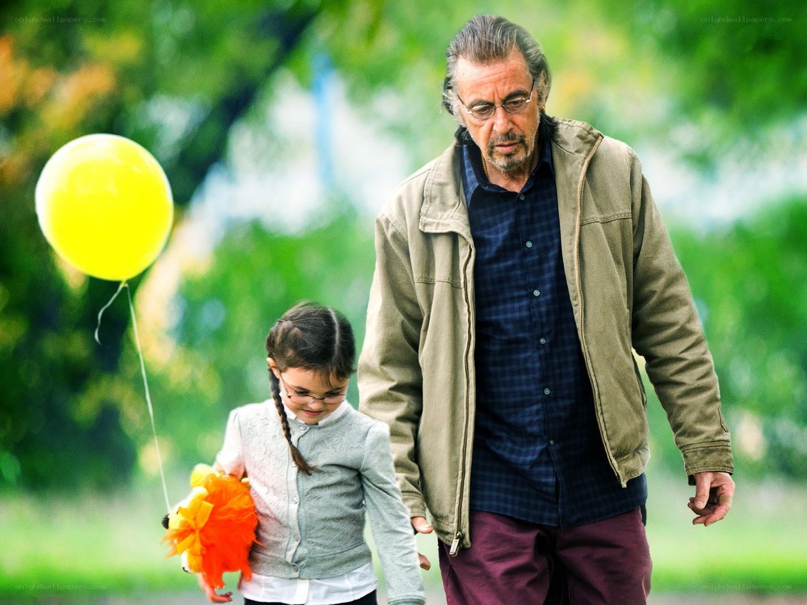 man and girl with balloon