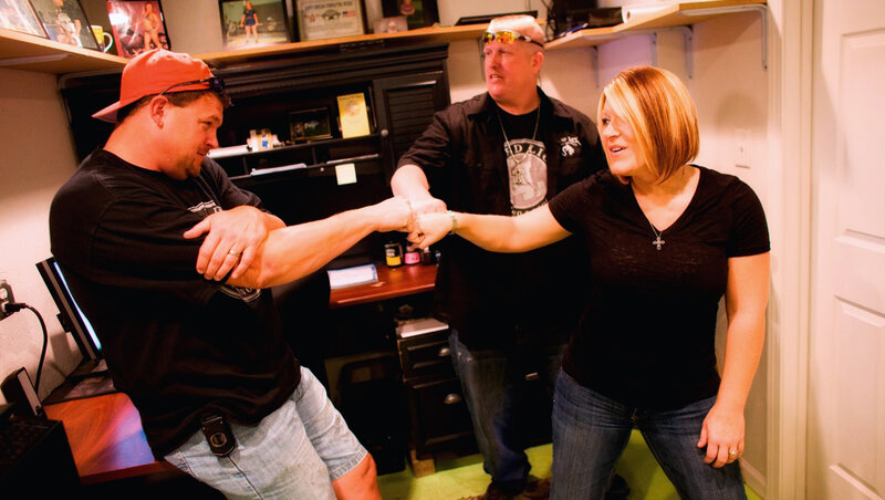 Man and Woman Arm Wrestling