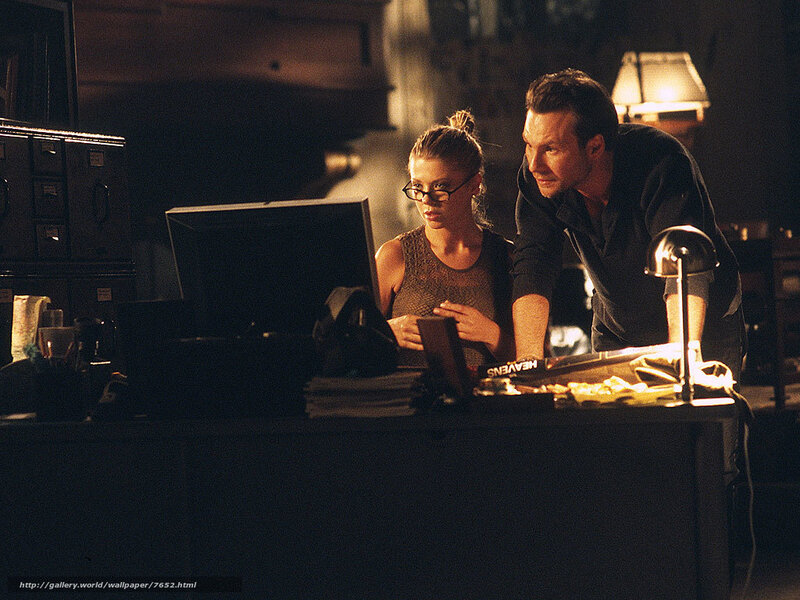 Man and woman at computer desk