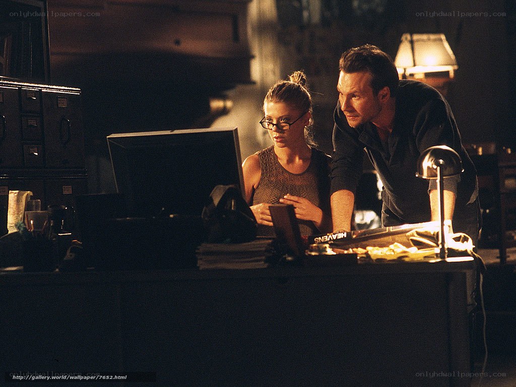 Man and woman at computer desk