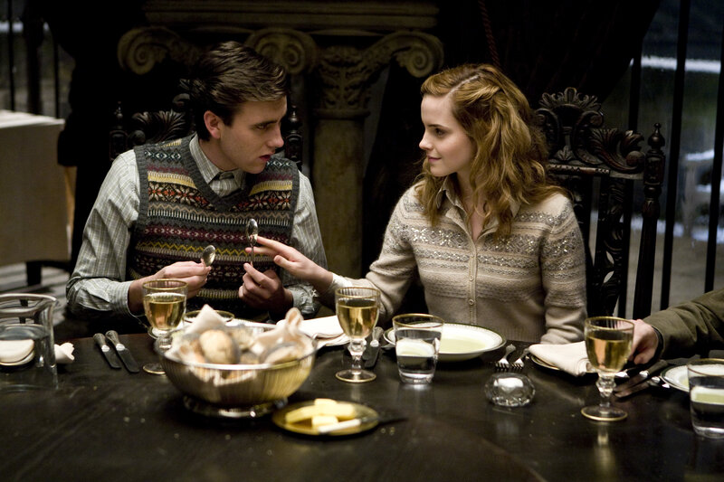 Man and Woman at Dinner Table — Brown