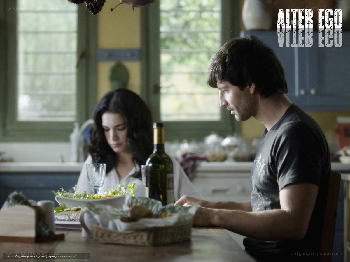 man and woman at dinner table