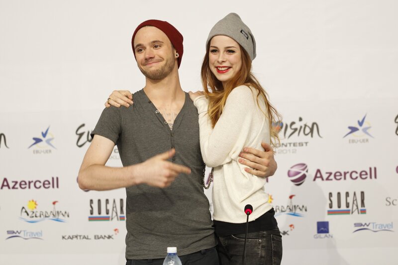 Man and woman at press event