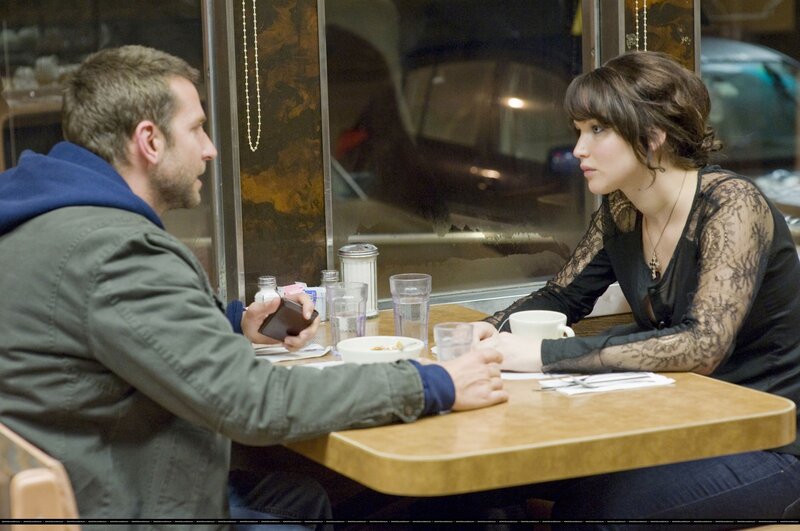 Man and Woman at Table — Brown, Serious, Night