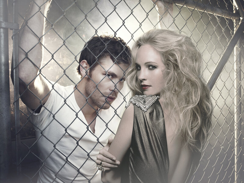 Man and Woman Behind Fence