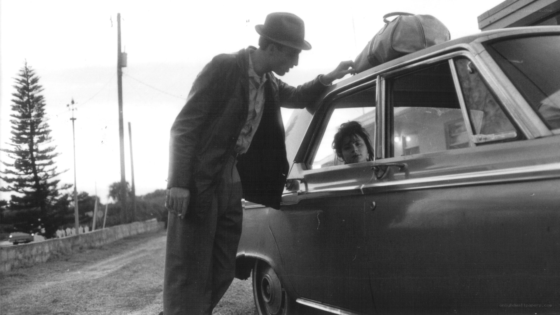 Man and woman by car