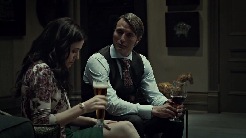 man and woman drinking in dim room