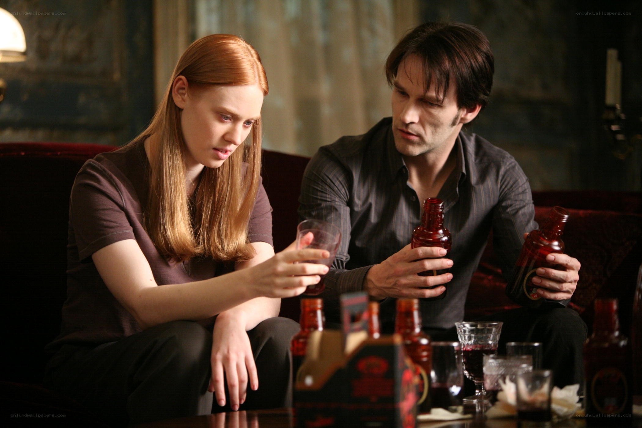 man and woman drinking together