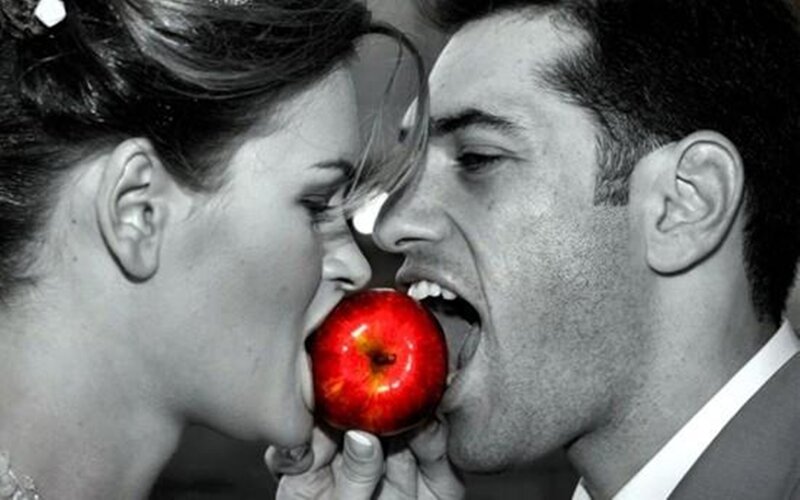 Man and Woman Eating Apple — Red
