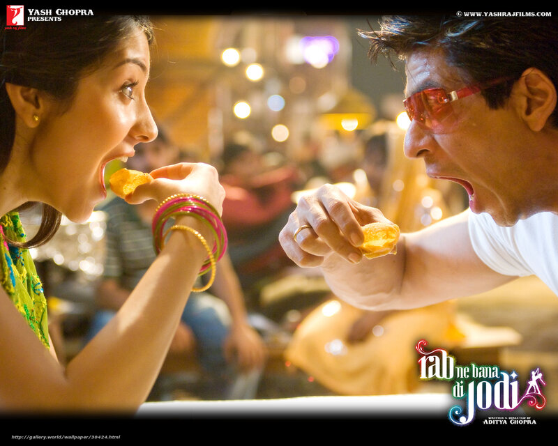 Man and Woman Eating Snacks