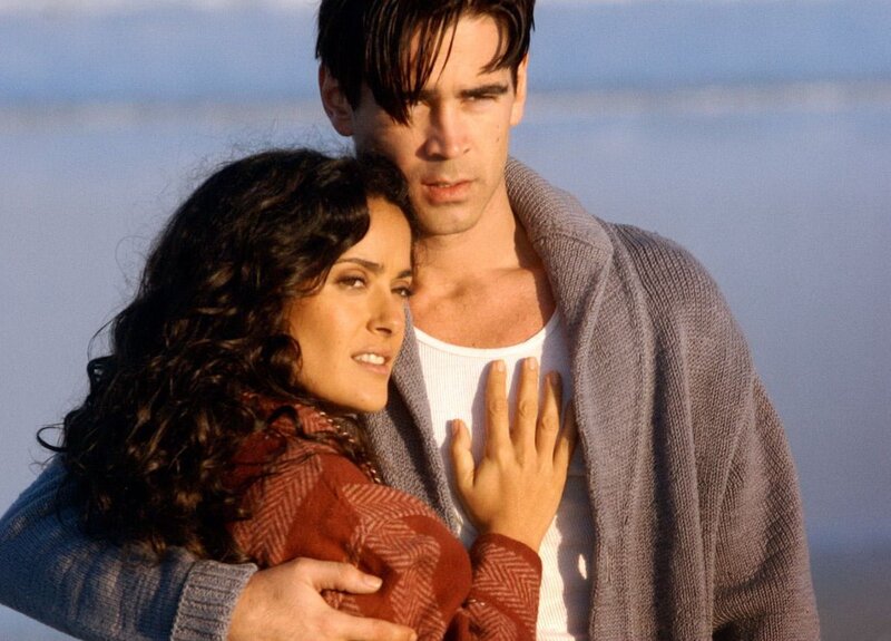 man and woman embracing on beach