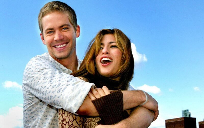 man and woman embracing outdoors