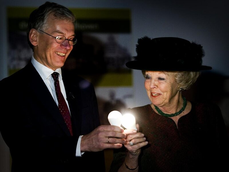 Man and Woman Holding Bulbs