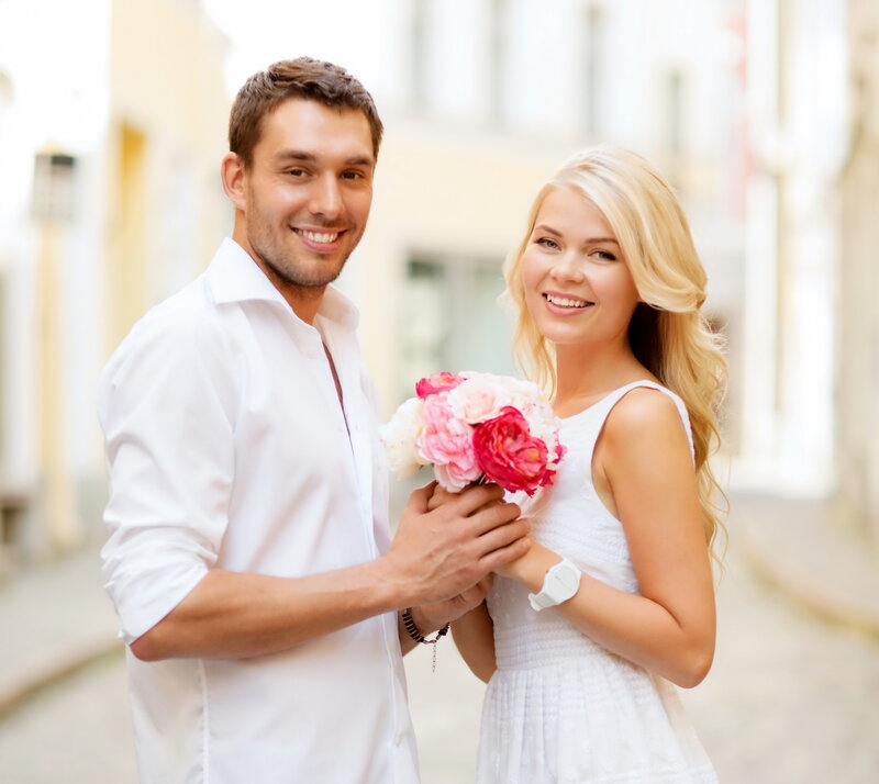 Man and Woman Holding Flowers — White, Happy