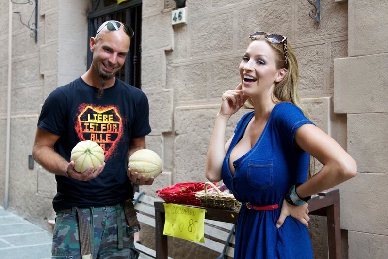 Man and Woman Holding Melons