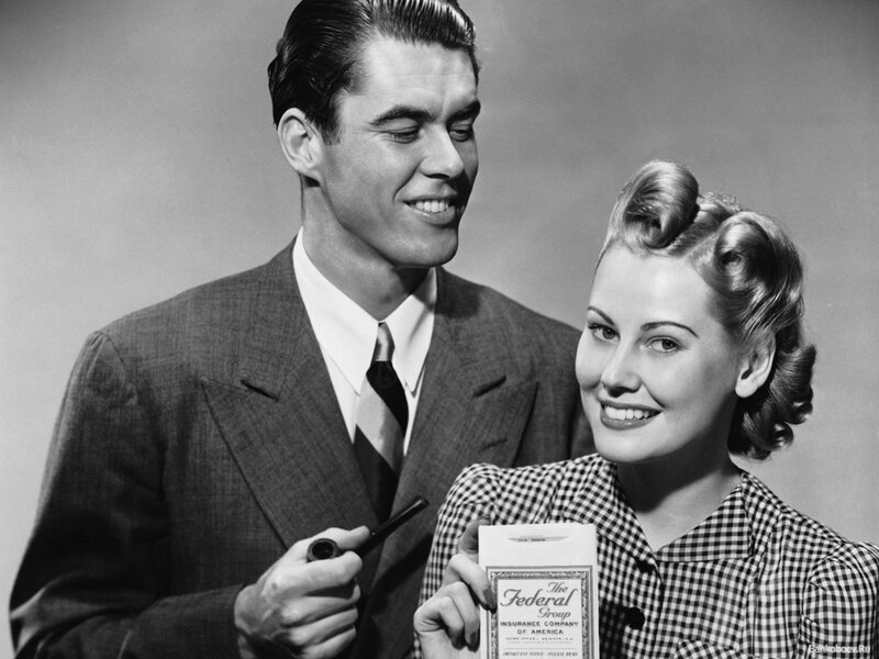 Man and Woman Holding Paper