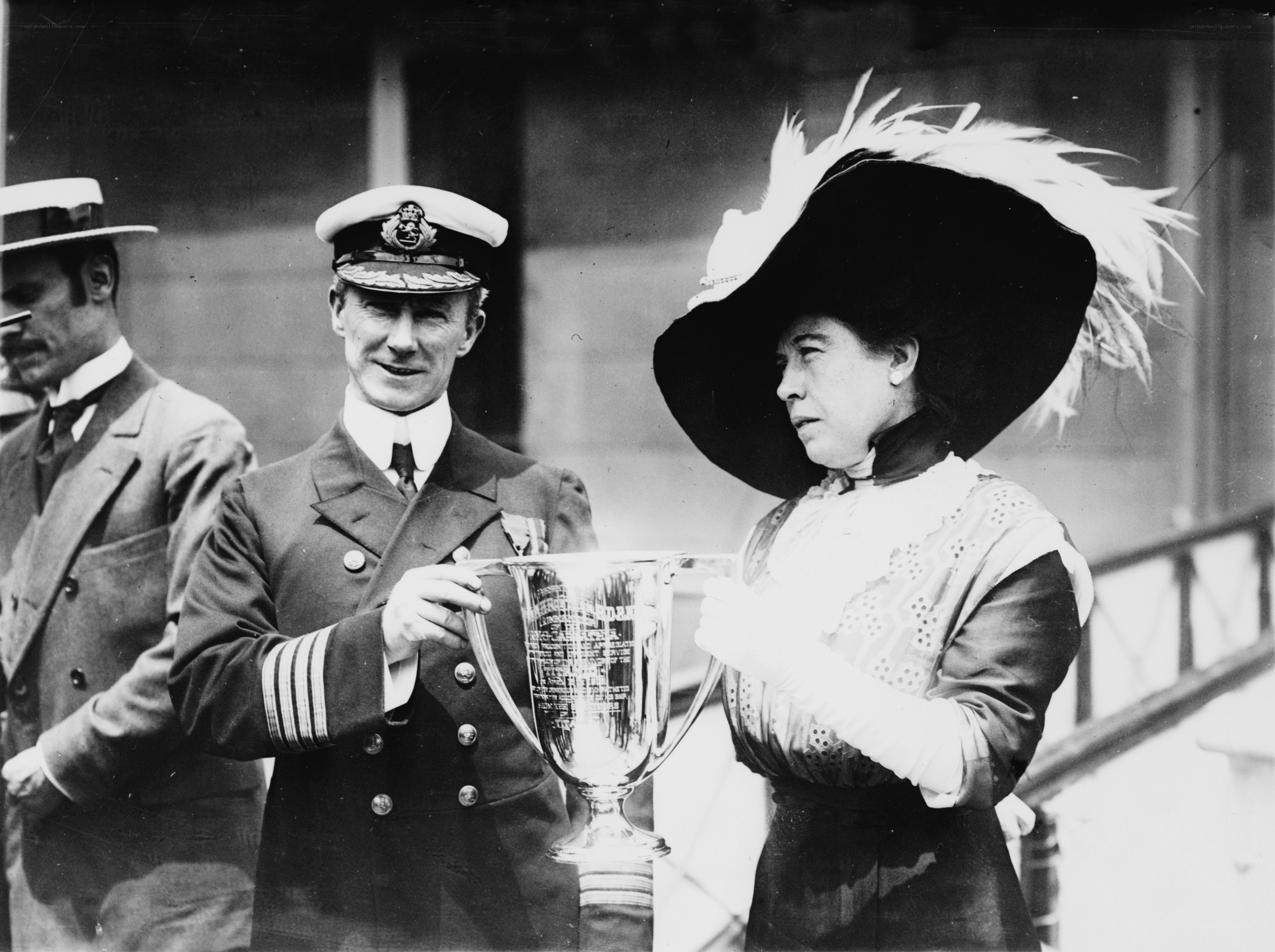 Man and woman holding trophy