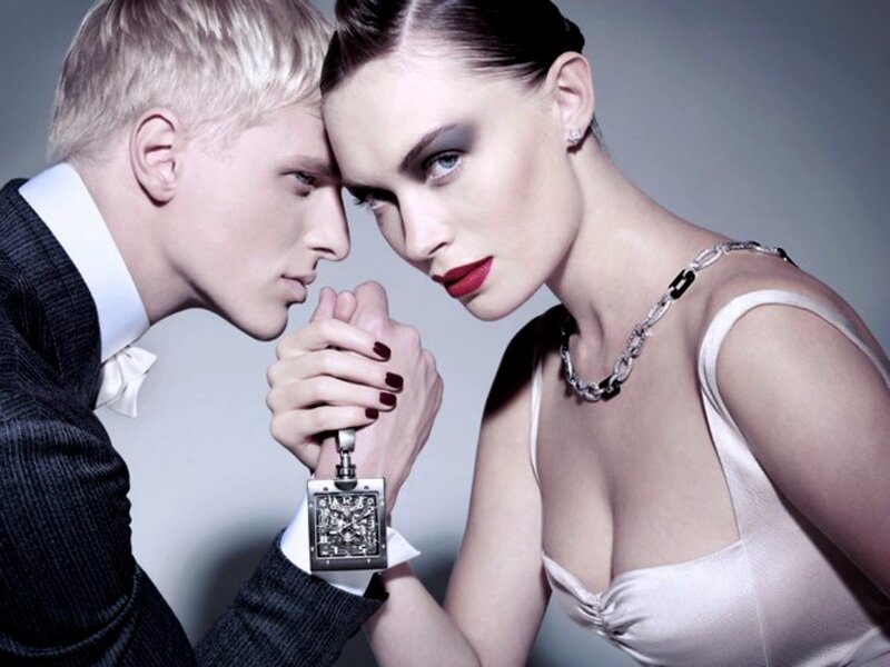 Man and Woman Holding Watch