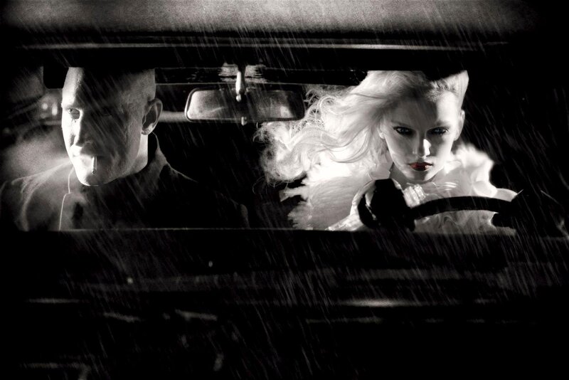 Man and woman in a car during rain