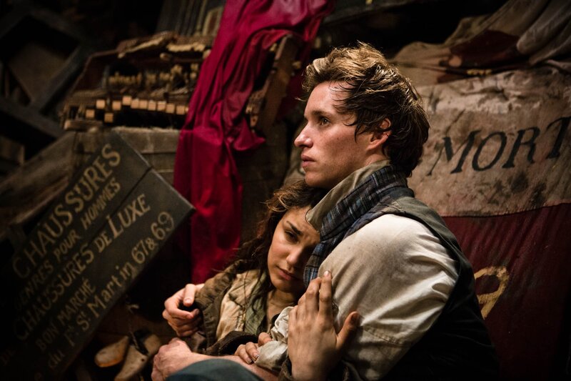 Man and woman in a crowded attic