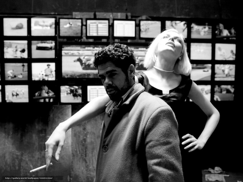 Man and woman in a surveillance room