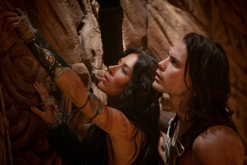 man and woman in ancient cave