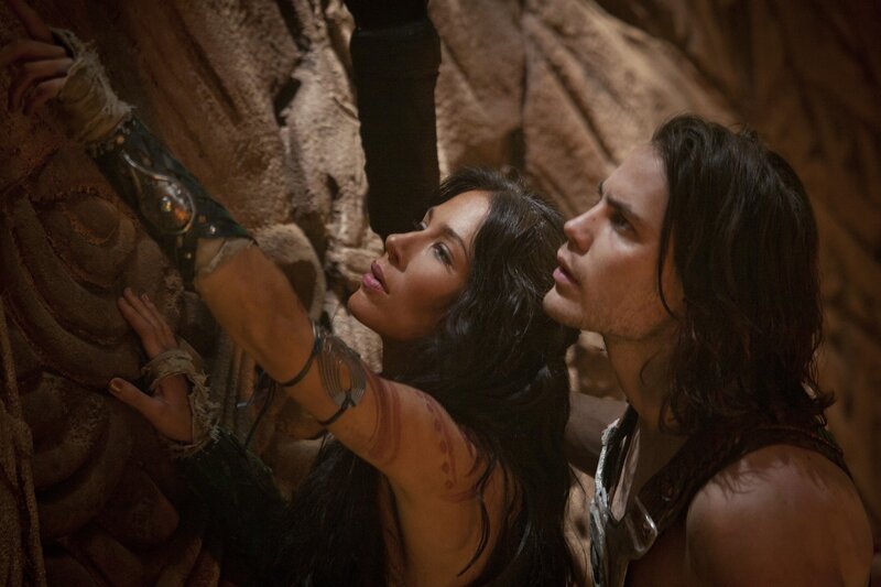 man and woman in ancient setting
