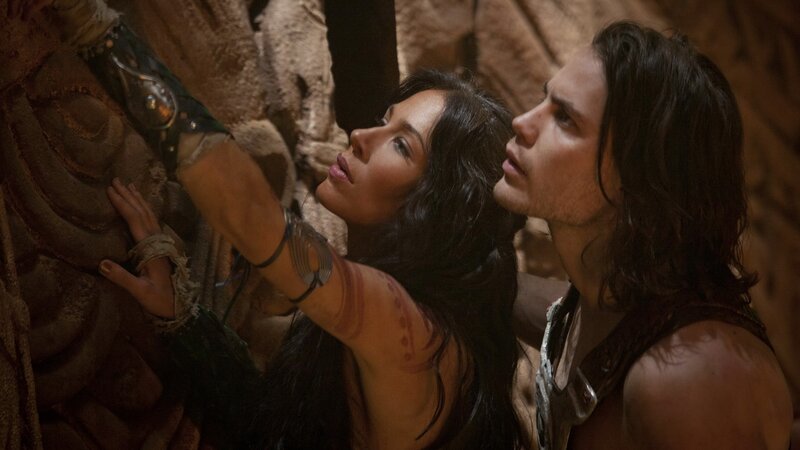 man and woman in ancient setting