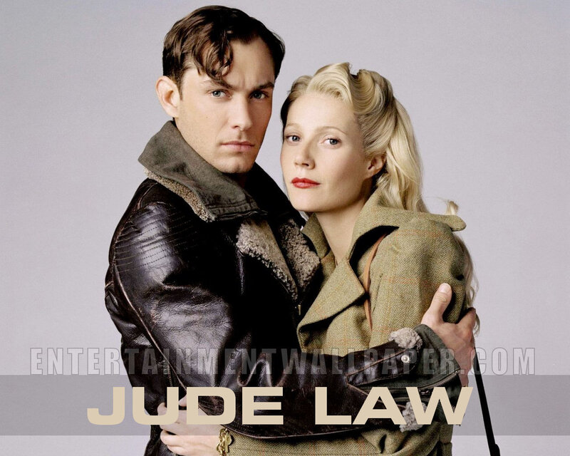 Man and Woman in Coats — Gray