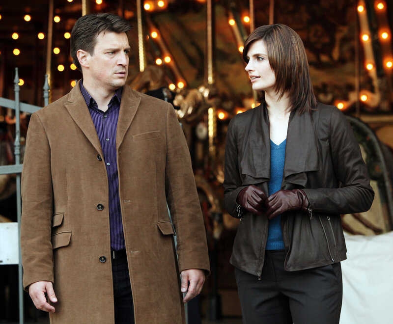 man and woman in coats