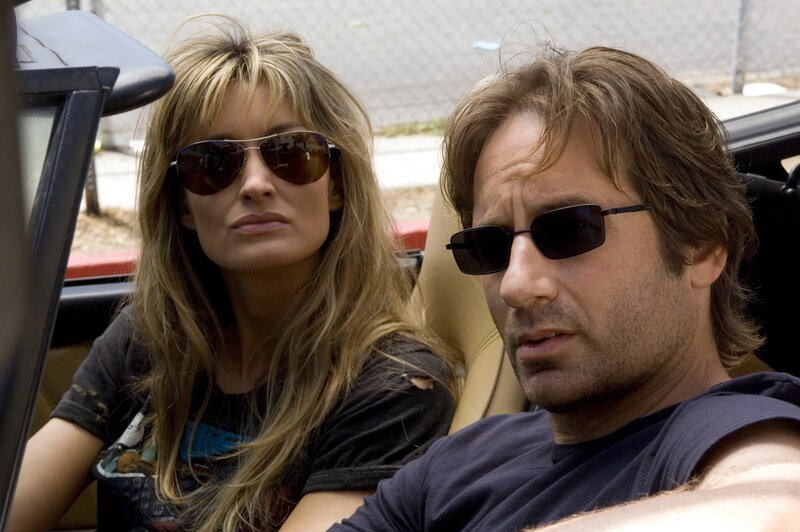 Man and woman in convertible car