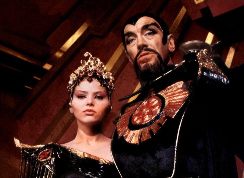 Man and Woman in Costumes — Black, Dramatic, Photograph