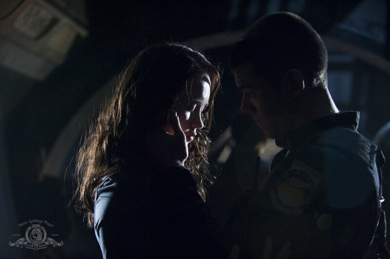 Man and Woman in Dark Room — Black, Dramatic, Night, Photograph, Uniform