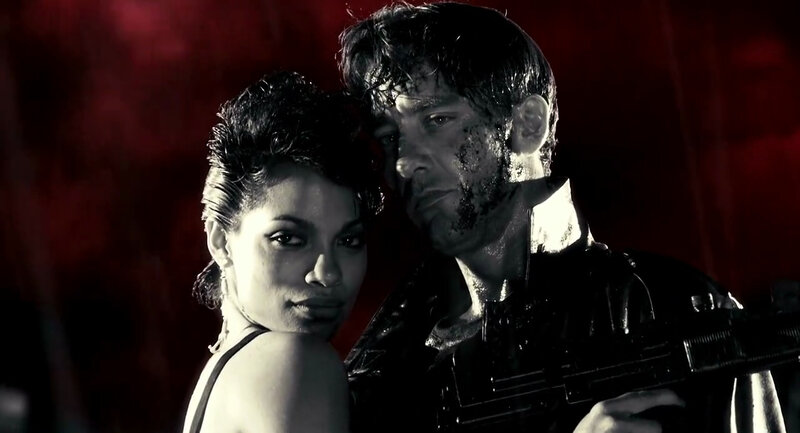 man and woman in dark scene