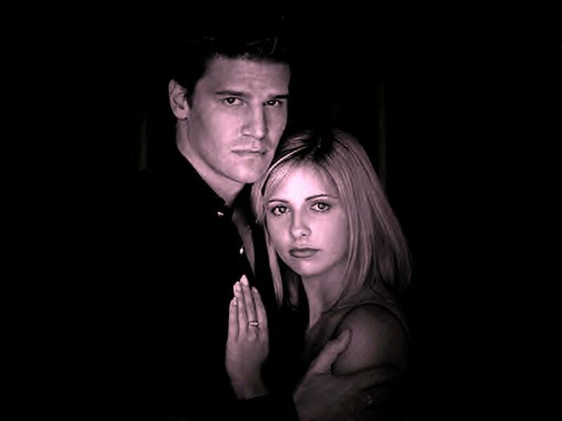 man and woman in dark setting