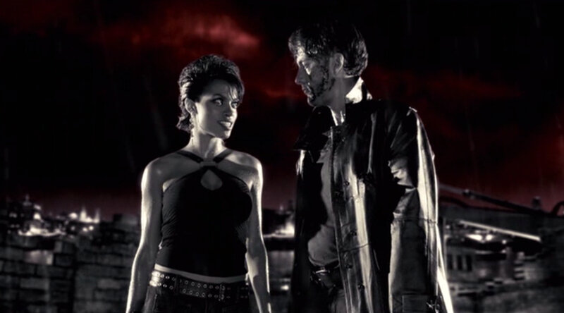 man and woman in dark setting