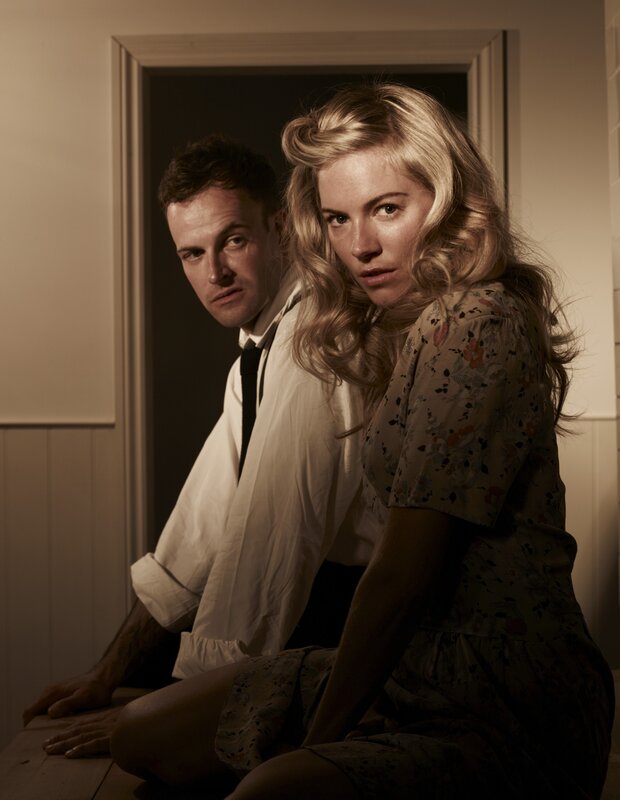 man and woman in dim light