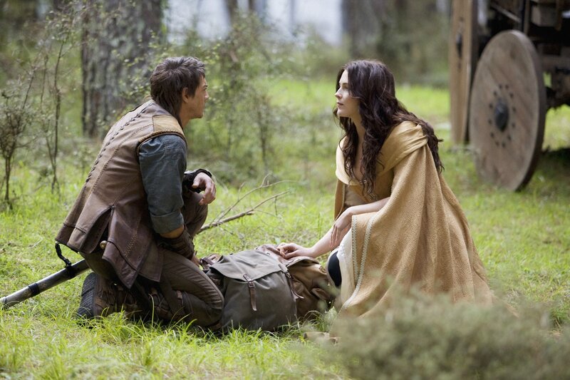 Man and woman in forest scene