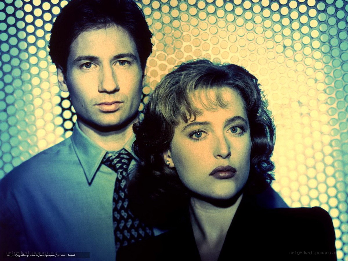 man and woman in front of patterned background